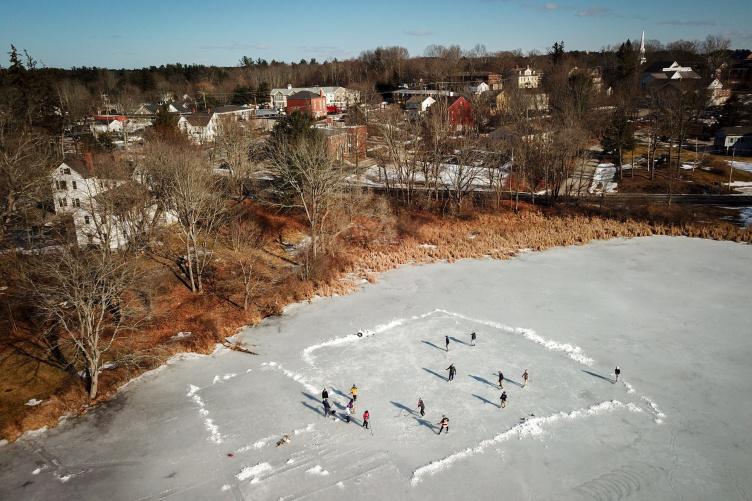 UNH students skating on the Mill Pond
